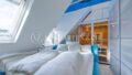 Schlafzimmer mit integrierter Sauna